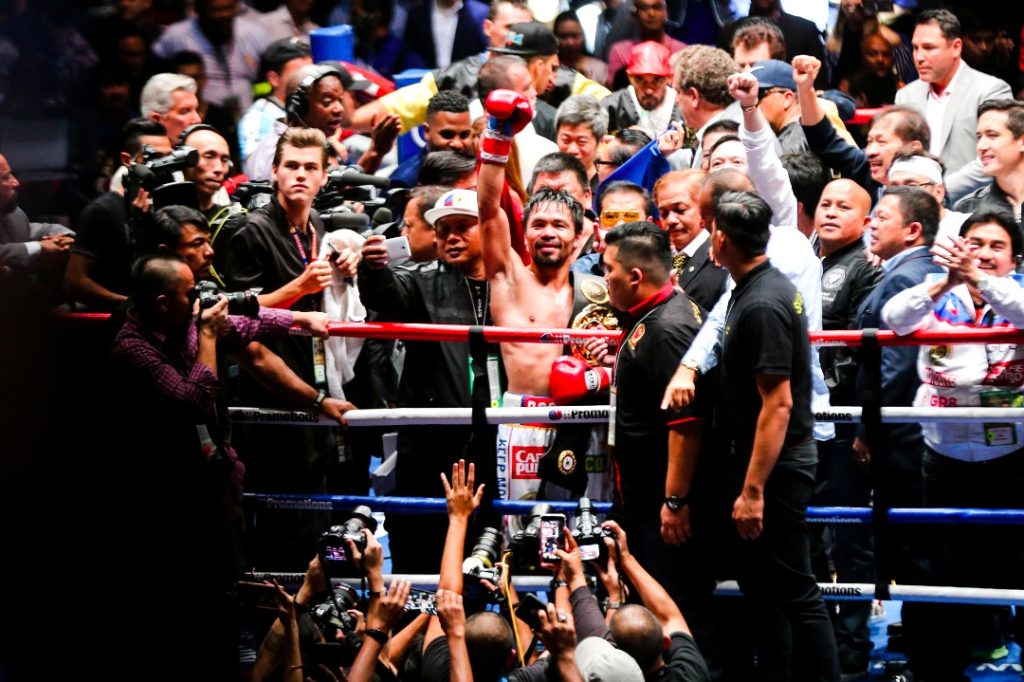 Pacquiao celebrates after beating Matthysse.