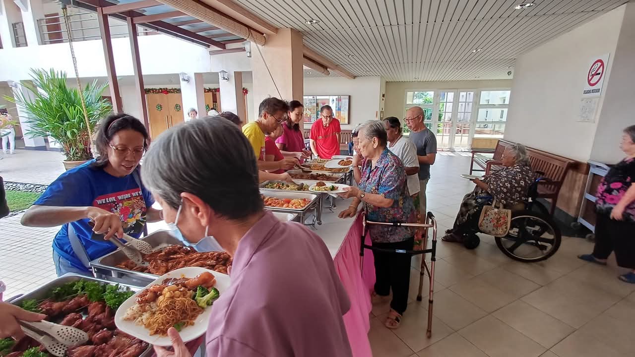 Residents at St Francis Xavier Home for the Elderly in Kuala Lumpur being treated with a Christmas-themed lunch on Dec 17, 2024.