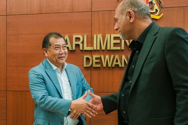  Deputy Digital Minister Datuk Wilson Ugak Anak Kumbong shakes Digital Minister Gobind Singh Deo's hand after amendments to the Personal Data Protection Act 2010 was passed in the Dewan Rakyat on July 31, 2024.