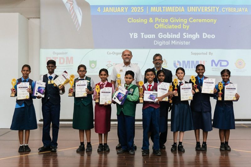 Digital Minister Gobind Singh Deo joins the young winners of the National Level ICT Competition for Tamil School Students 2024 at Multimedia University in Cyberjaya, Selangor on Jan 4, 2025.